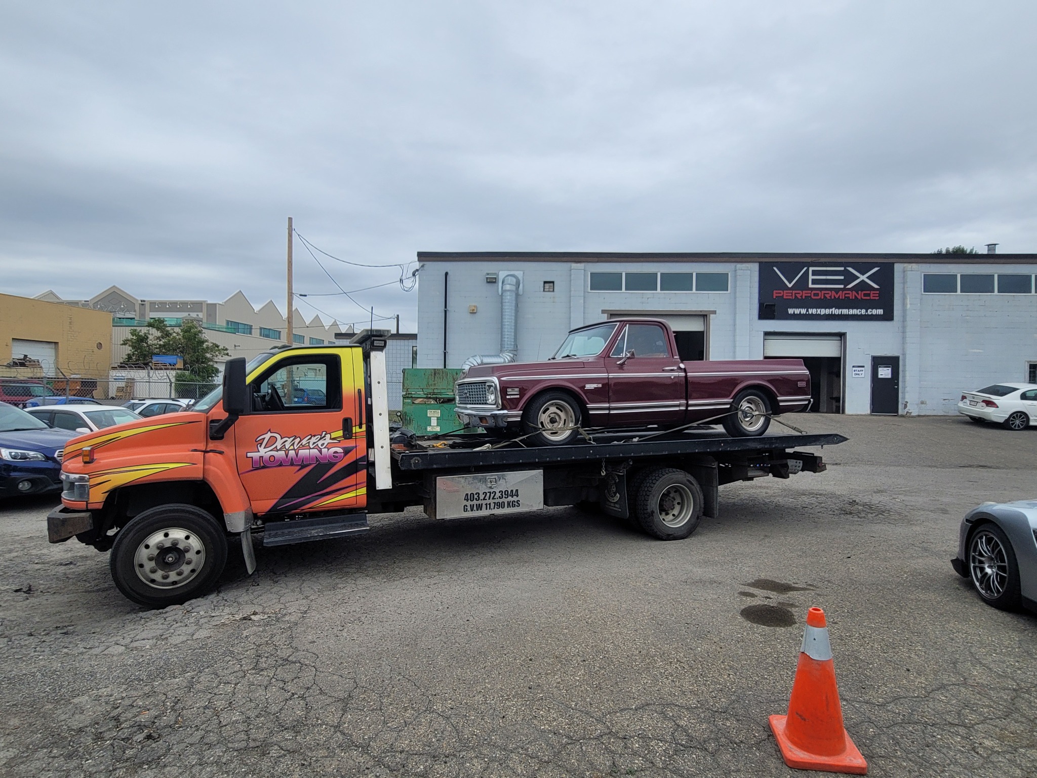 Classic pickup truck being towed on a flatbed